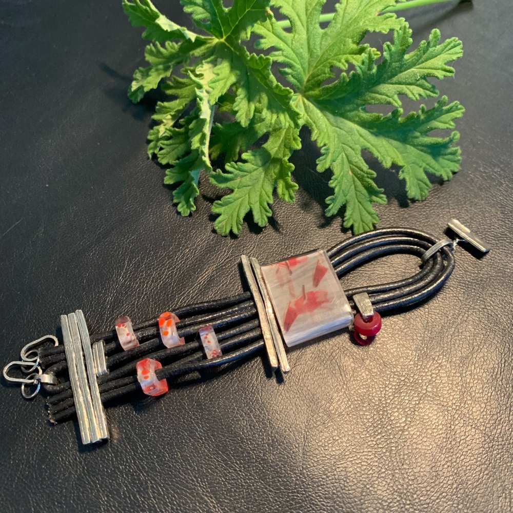 One of a Kind Leather Bracelet with Lucite Clear/Red and Pewter Adornments.